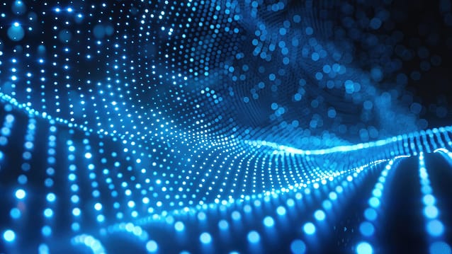 Technician inspecting server racks in a secure data centre