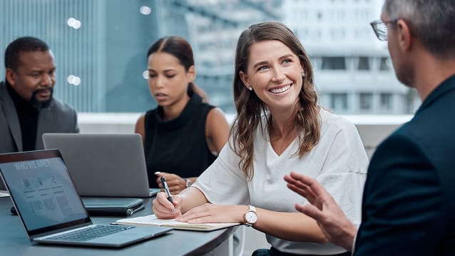 Technician inspecting server racks in a secure data centre